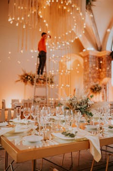 Chic wedding reception setup with vibrant lighting and elegant table decor.